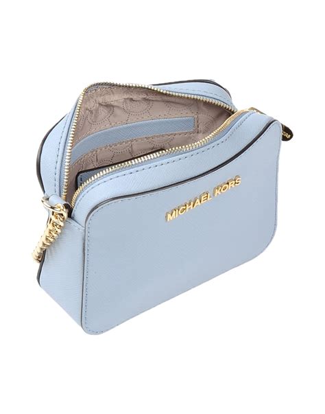 blue michael kors cinch crossbody|Michael Kors Crossbody bag.